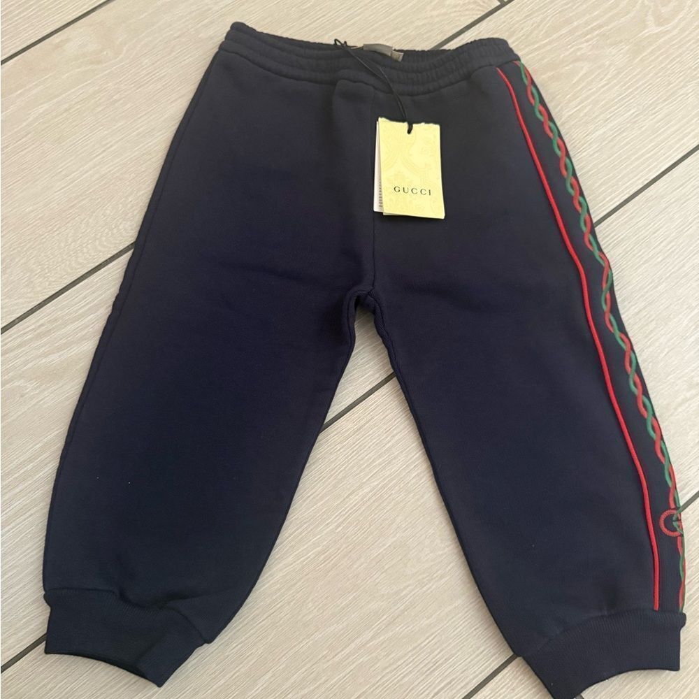Brand new Gucci navy Sweatpants with Tapered Gucci Design size 2